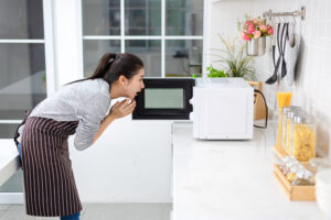 women shock cooking from microwave