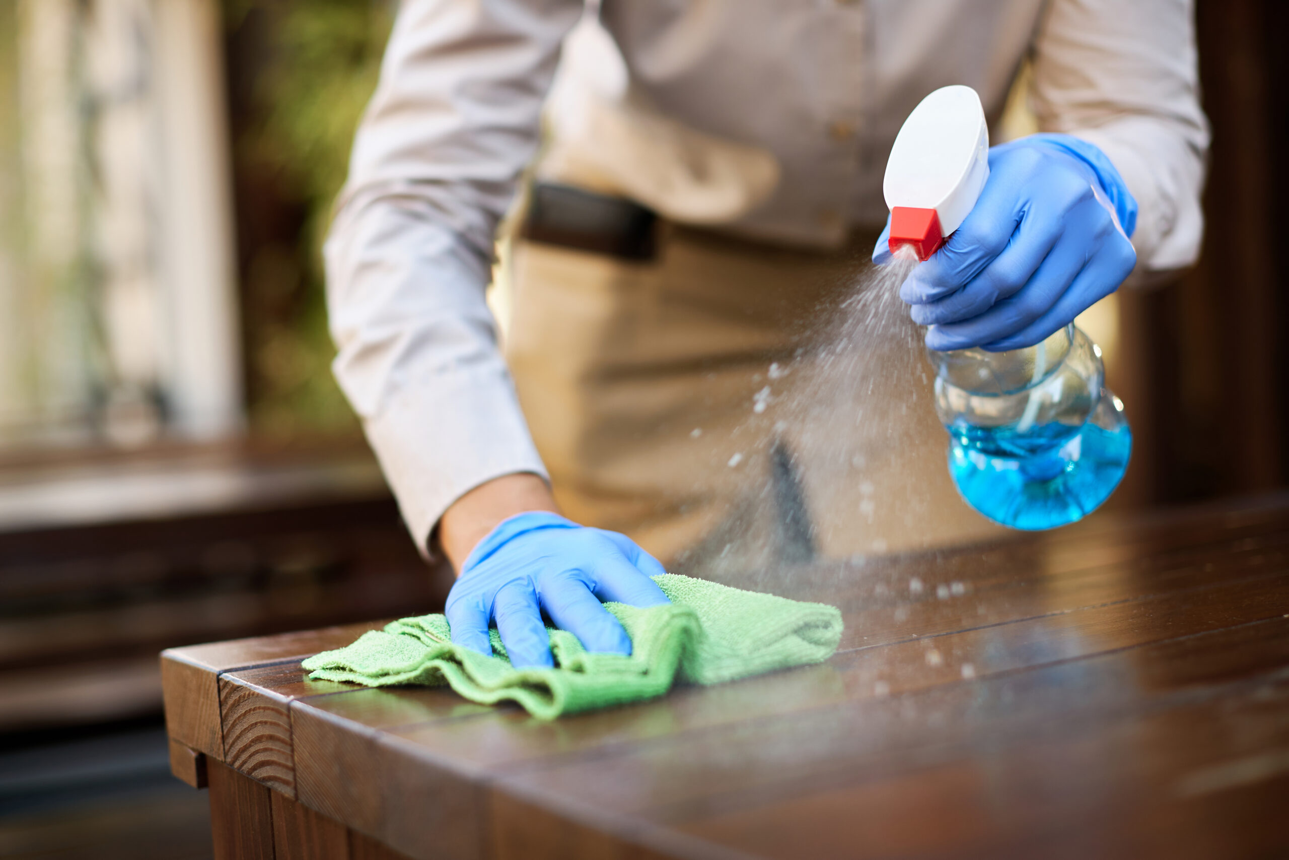 Closeup Waitress Disinfecting Tables Outdoor Cafe Scaled