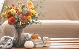 Cozy Autumn Composition With Bouquet Chrysanthemums Vase Pumpkins Knitted Element Blurred Background Interior
