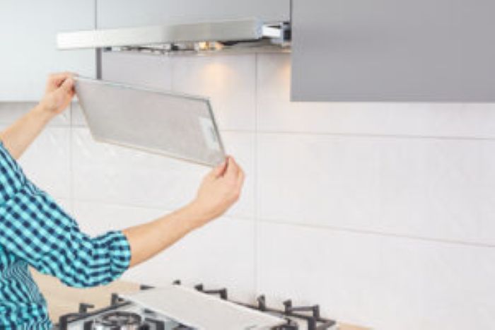 Mans Hands Removing Filter From Cooker Hood Cleaning Service Replacing Filter Kitchen Hood Modern Kitchen Fan Range Hood 300X200 1