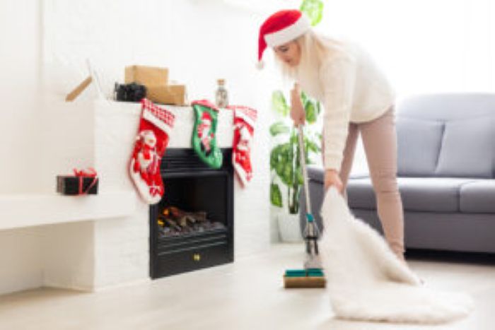 Young Attractive Woman Cleaning House Before Christmas Celebration 300X200 1