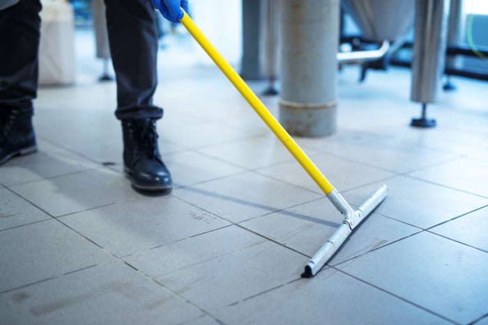Close Up Mop Cleaning Industrial Plant Floor