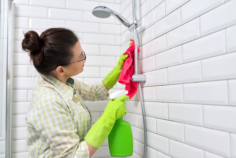 Bathroom Cleaning Housewife Washing White Tile Wall With Detergent Rag Copy Space Hygiene Purity Cleanliness Concept