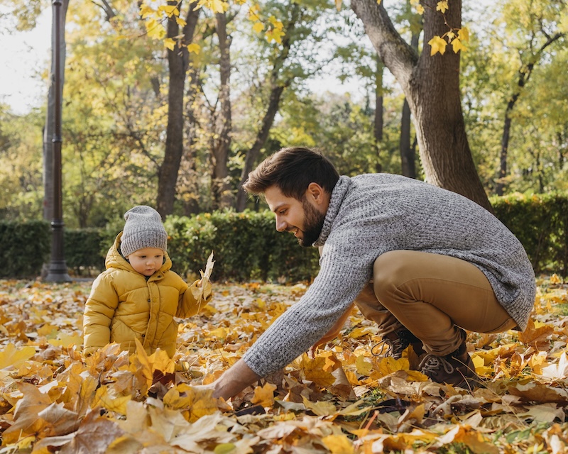 Happy Father With Baby Outdoors Nature