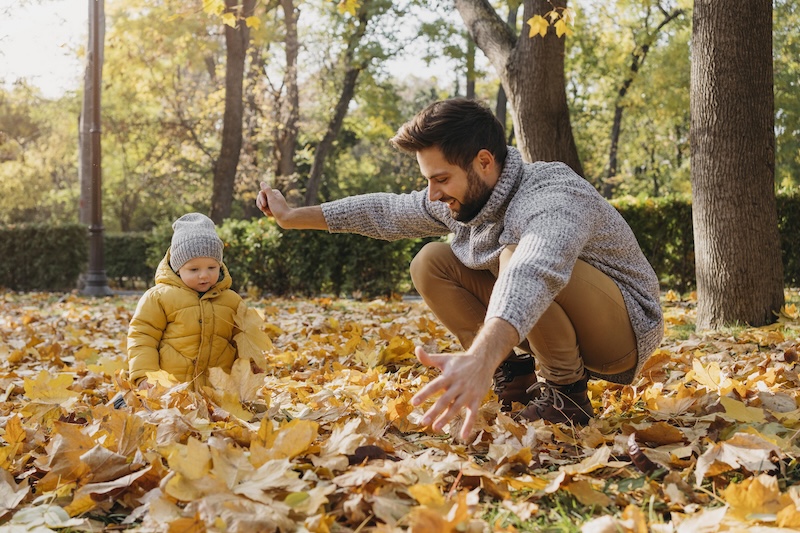 Happy Father With Baby Outside