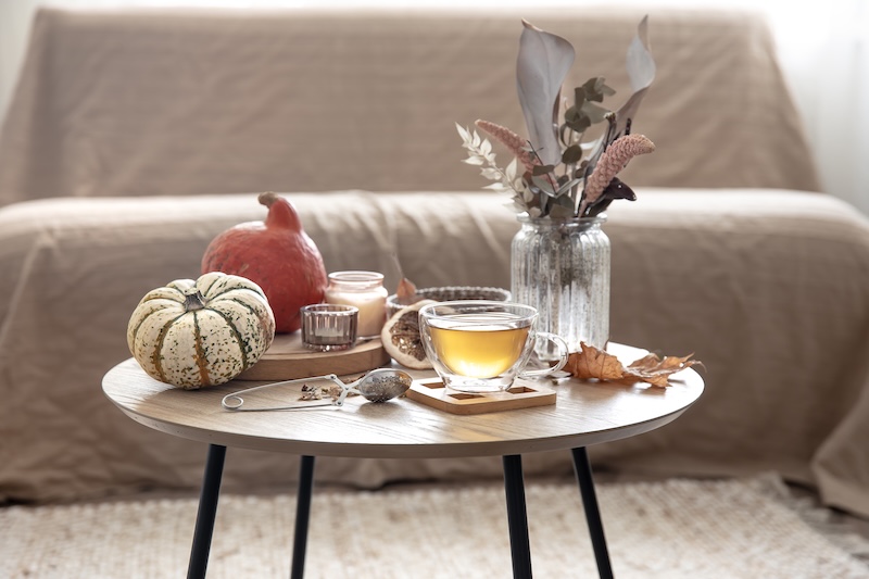 Cozy Home Still Life With Cup Tea Pumpkins Candles Autumn Decor Details Table Blurred Background Room 1