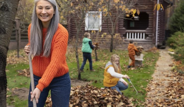 kids raking with an old lady