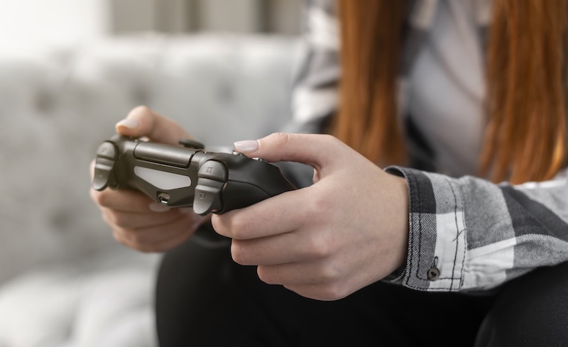 Female Playing Video Games Close Up