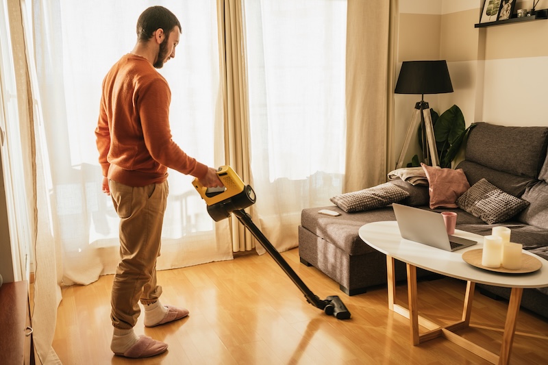 Man Vacuuming His Apartment