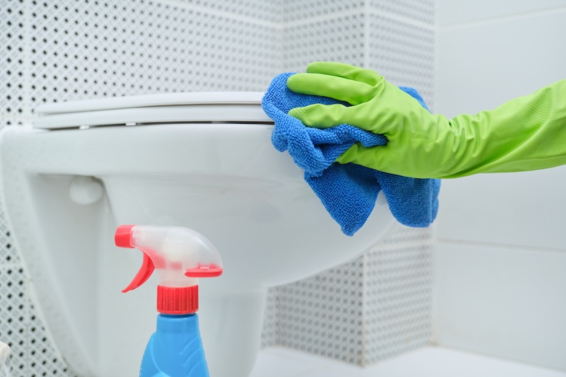 Close Up Hand Gloves With Rag Detergent Washing Hanging Toilet