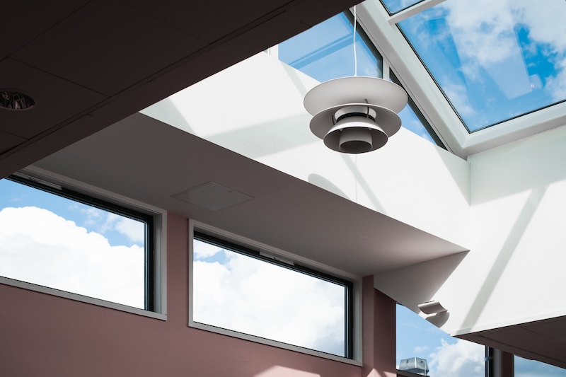 Low Angle Shot Lamp Hanging Inside Building With Glass Ceiling
