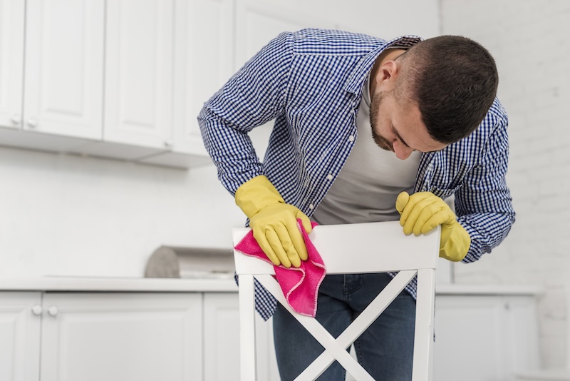 Man Cleaning Chair 1