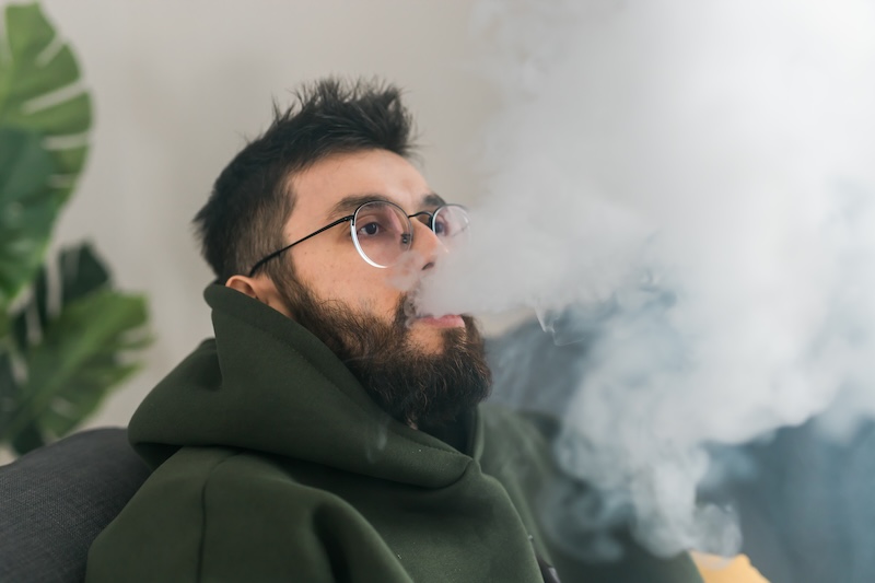 Portrait Bearded Man Is Smoking Hookah Home Blowing Cloud Smoke Copy Space Place