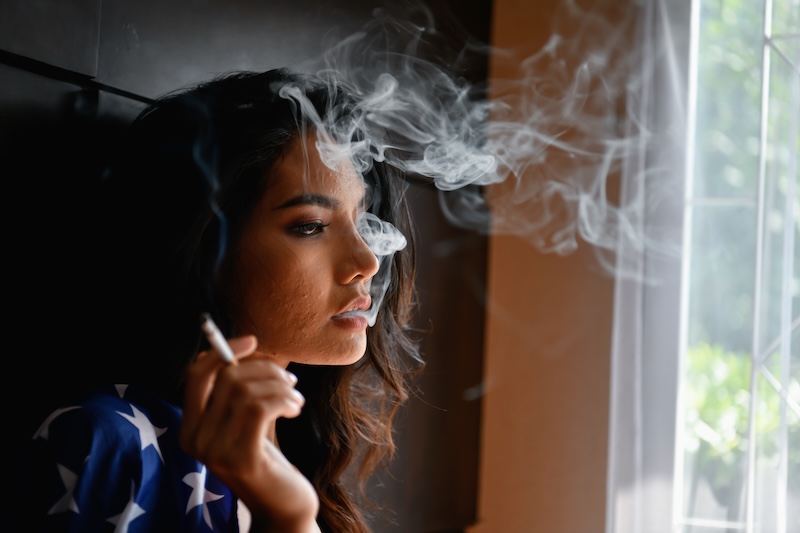 Side View Young Woman Smoking Cigarette Home