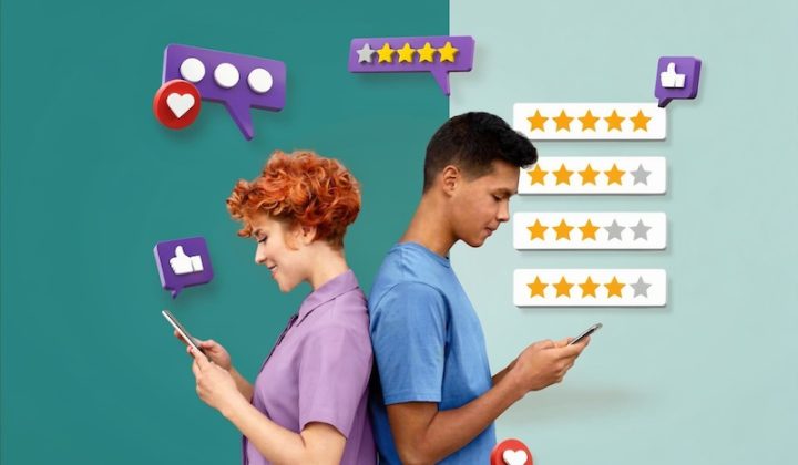 Two people stand back-to-back, smiling at their phones. Floating icons display likes, stars, and message bubbles, suggesting social media interaction.
