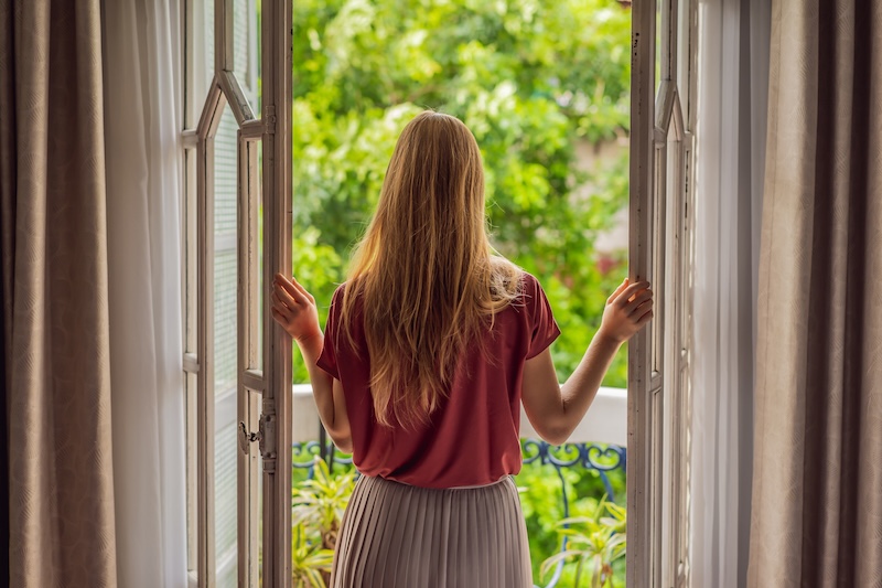 Gingerhaired Woman Stands Heritagestyle Balcony Enjoying Her Morning Coffee Woman