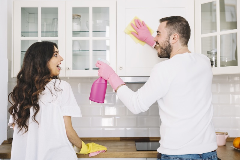 Couple Cleaning Kitchen Together 1