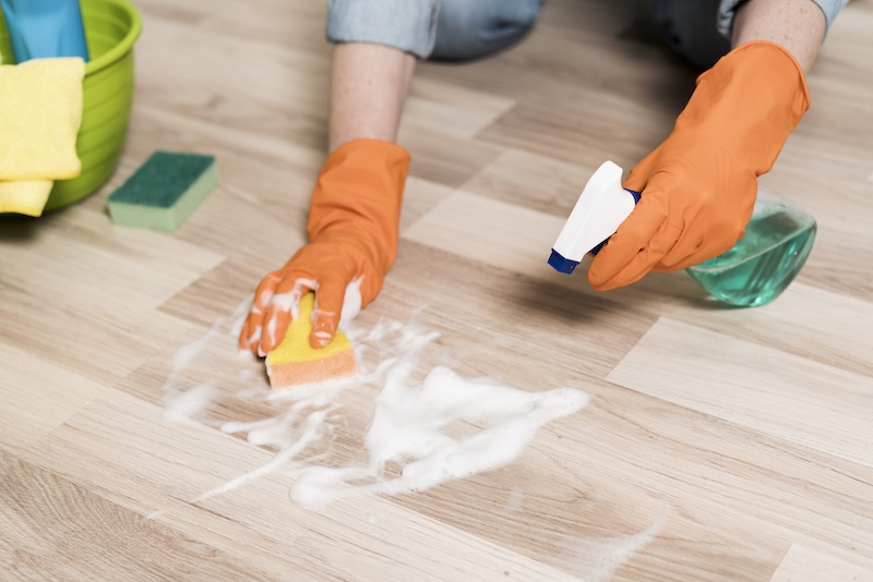 High Angle Woman Cleaning Floors