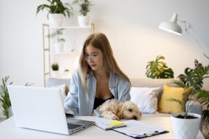 medium shot woman working with dog